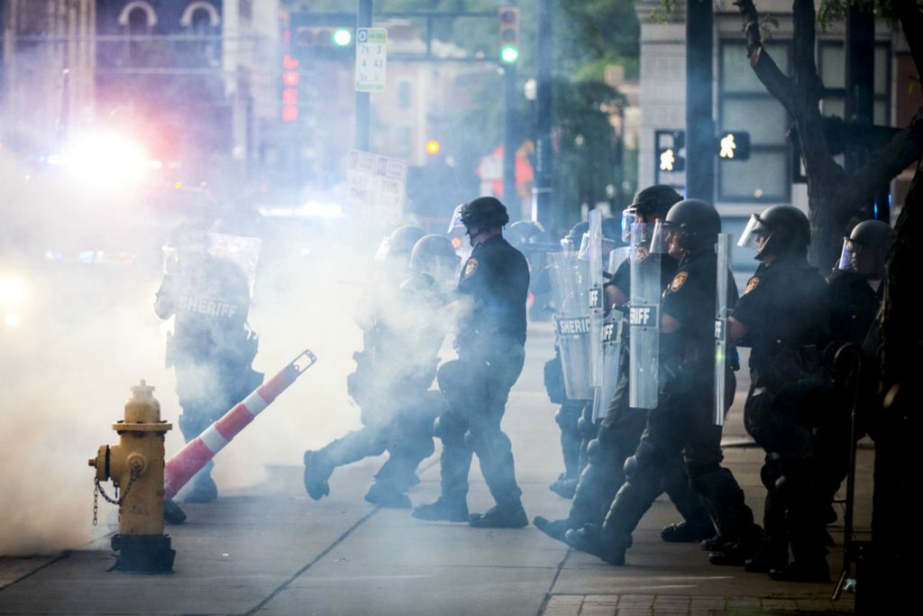 Award of Excellence, News Picture Story - Meg Vogel / The Cincinnati Enquirer, “BLM Protest”Hamilton County Sheriff Deputies respond to protesters with tear gas outside the Hamilton County Courthouse in downtown Cincinnati on Sunday, May 31, 2020. This is the third night of protests in response to the death of George Floyd in Minneapolis.