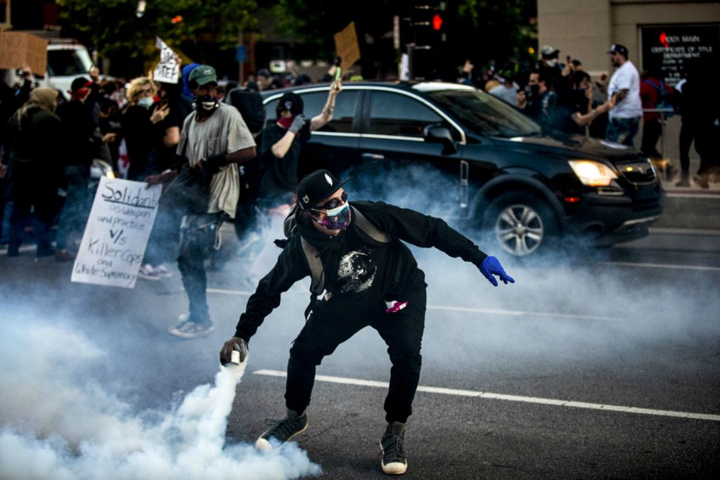 Award of Excellence, News Picture Story - Meg Vogel / The Cincinnati Enquirer, “BLM Protest”A protester throws tear gas away from the crowd gathered outside the Hamilton County Courthouse in downtown Cincinnati on Sunday, May 31, 2020. This is the third night of protests in response to the death of George Floyd in Minneapolis.