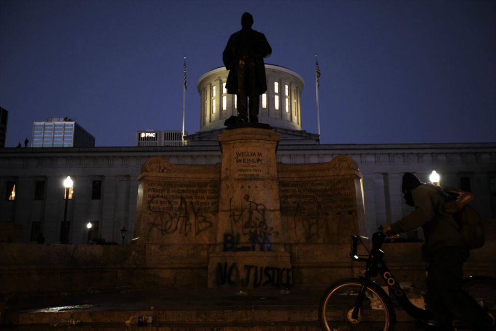 First Place, James R. Gordon Ohio Understanding Award - Joshua A. Bickel / The Columbus Dispatch, “Political Climate of Southeast Ohio”Graffiti is seen on a statue of President William McKinley outside the Ohio Statehouse as protests continue following the death of Minneapolis resident George Floyd on Saturday, May 30, 2020 in Columbus, Ohio.