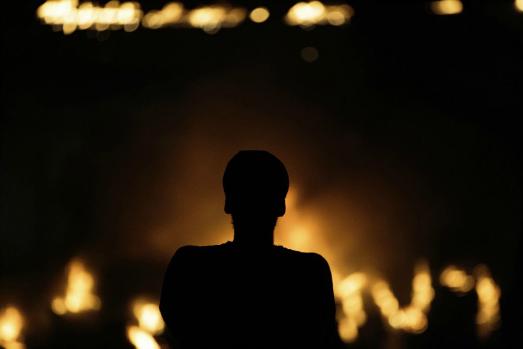 First Place, James R. Gordon Ohio Understanding Award - Joshua A. Bickel / The Columbus Dispatch, “Political Climate of Southeast Ohio”A man watches as a pile of wooden pallets burn after unknown persons set fire to them as protests continue following the death of Minneapolis resident George Floyd on Saturday, May 30, 2020 in Columbus, Ohio.
