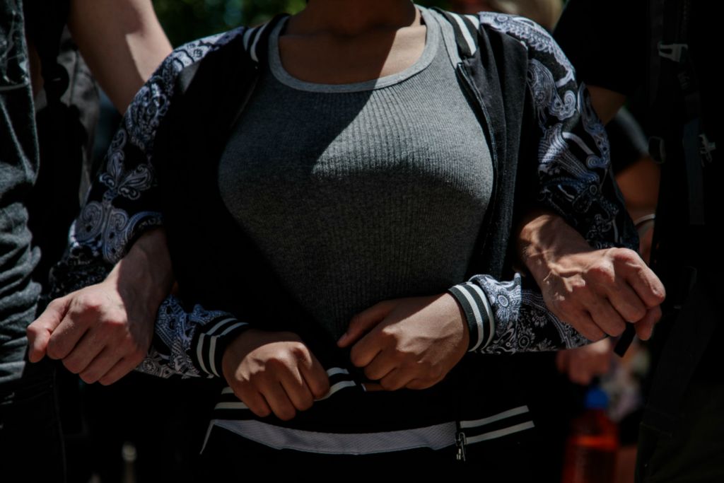 First Place, James R. Gordon Ohio Understanding Award - Joshua A. Bickel / The Columbus Dispatch, “Political Climate of Southeast Ohio”A young woman links arms with two men as they protest along High Street following the death of Minneapolis resident George Floyd on Monday, June 1, 2020 in Columbus, Ohio. Floyd, a 46-year-old black man, was killed while in police custody after allegedly passing a counterfeit $20 bill at a conveinence store. Derek Chauvin, one of four Minneapolis police officers involved in Floyd's arrest, has himself been arrested and charged with third-degree murder and manslaughter. During the arrest, video footage showed Chauvin kneeling on Floyd's neck for almost nine minutes as Floyd repeatedly said "I can't breathe." 