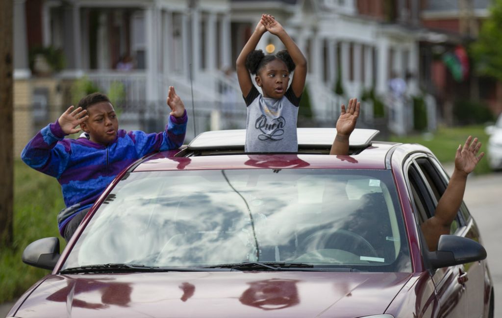 First Place, James R. Gordon Ohio Understanding Award - Adam Cairns / The Columbus Dispatch, “Political Climate of Southeast Ohio”A family holds their hands up as demonstrators march past them in the King-Lincoln District during a George Floyd protest in Columbus on Wednesday, June 3, 2020. 