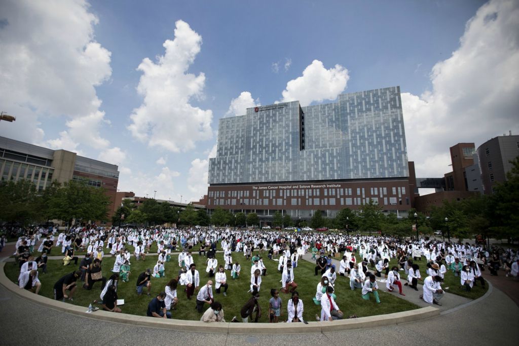 First Place, James R. Gordon Ohio Understanding Award - Courtney Hergesheimer / The Columbus Dispatch, “Political Climate of Southeast Ohio”Doctors, nurses, medical students, and staff take a knee for eight minuets and 46 seconds, in front of the James Cancer Hospital, in solidarity with the Black Lives Matter movement, Friday, June 5, 2020.  
