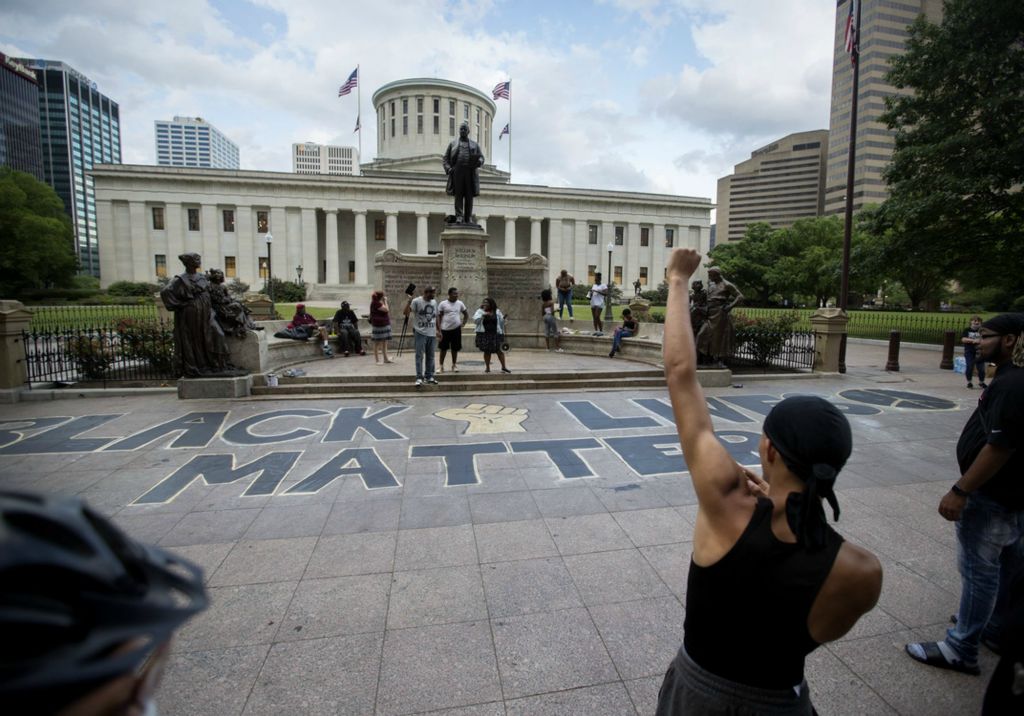 First Place, James R. Gordon Ohio Understanding Award - Courtney Hergesheimer / The Columbus Dispatch, “Political Climate of Southeast Ohio”Protestors celebrate after painting"Black Lives Matter" on the sidewalk on High St. in front of the Ohio Statehouse, in Columbus, Wednesday, June 10, 2020. 