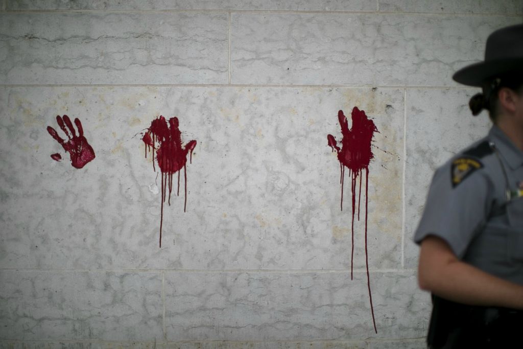First Place, James R. Gordon Ohio Understanding Award - Courtney Hergesheimer / The Columbus Dispatch, “Political Climate of Southeast Ohio”A small group of protestors painted red hands on the Ohio Statehouse, to signify the blood on police hands, they said, Thursday, June 18, 2020. 
