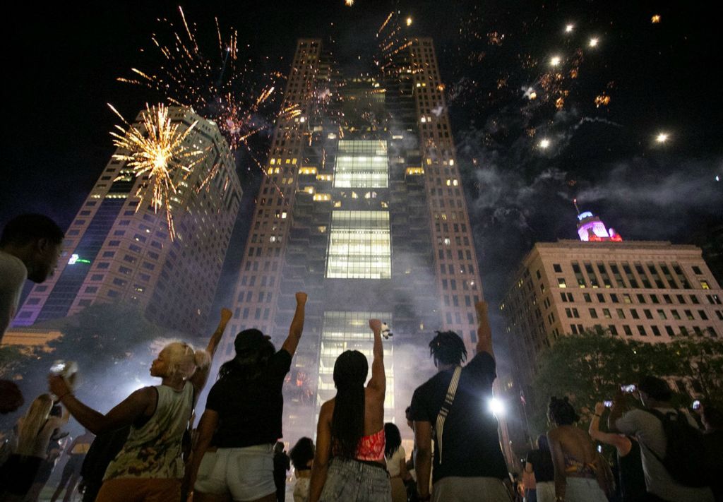 First Place, James R. Gordon Ohio Understanding Award - Courtney Hergesheimer / The Columbus Dispatch, “Political Climate of Southeast Ohio”Fireworks were set off on High St. during a celebration of Juneteenth in front of the Statehouse, Friday, June 19, 2020. Demonstrators, blocked off High St. at Broad and State streets.  "Juneteenth 2020, were making history!" DJ Polomoe shouted over the mic.