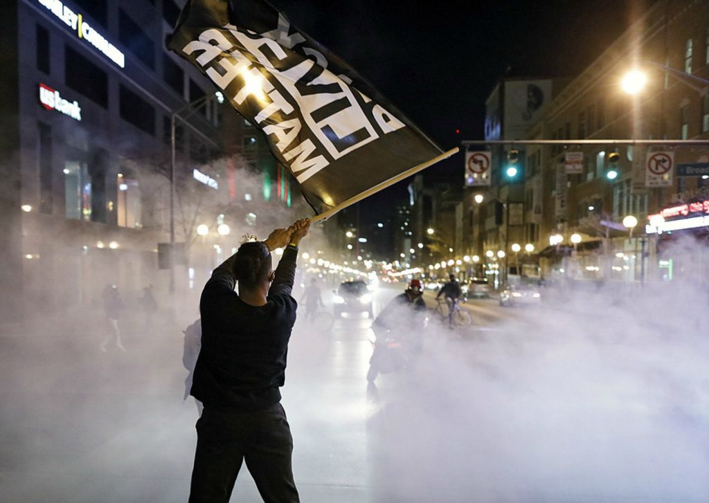 First Place, James R. Gordon Ohio Understanding Award - Kyle Robertson/Columbus Dispatch / The Columbus Dispatch, “Political Climate of Southeast Ohio”Tyler Darling waves a Black Lives Matter flag among motorcycle tire smoke on High Street during a rally that started at the Franklin County Sheriff's Office building in Downtown Columbus on December 11, 2020. Over 500 protesters demanding justice for Casey Goodson Jr. marched around downtown on the evening. One week ago, on Dec. 4, sheriff's SWAT deputy Jason Meade fatally shot 23-year-old Goodson, a Black man, at his home in the Northland neighborhood on the city's Northeast Side.