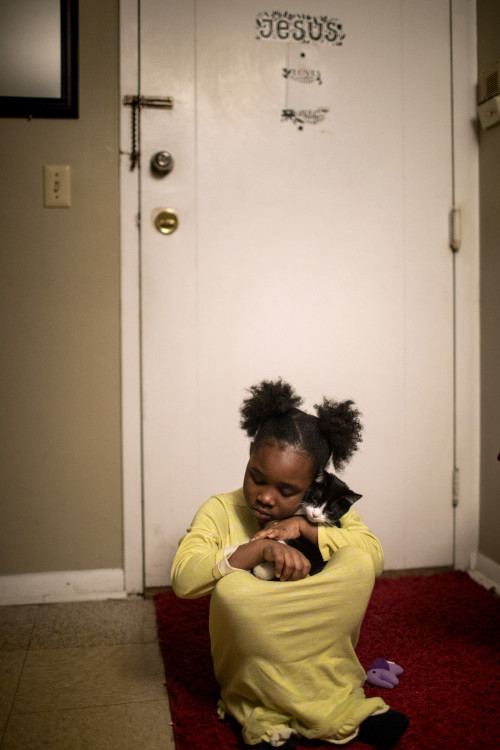 First Place, George S. Smallsreed Jr. Photographer of the Year - Large Market - Meg Vogel / The Cincinnati EnquirerAngelina, 7, snuggles her cat, Bobo, before bedtime on Wednesday, February 26, 2020 in Westwood.  Page Berry's daughters have asked for a pet for years. She could finally get the 4-month-old kitten because the apartment complex didn't charge for pets.