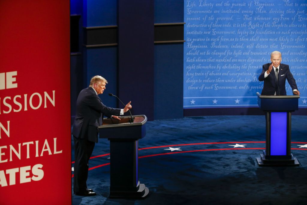 First Place, George S. Smallsreed Jr. Photographer of the Year - Large Market - Meg Vogel / The Cincinnati EnquirerPresident Donald Trump and Democratic presidential candidate, former Vice President Joe Biden, answer a question simultaneously during the first Presidential debate at the Cleveland Clinic on Tuesday, September 29, 2020.  
