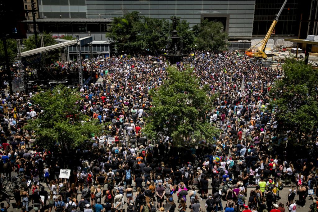 First Place, George S. Smallsreed Jr. Photographer of the Year - Large Market - Meg Vogel / The Cincinnati EnquirerThousands gather to protest racial injustices and police brutality on Fountain Square in downtown Cincinnati on Sunday, June 7, 2020. This is the tenth day of protests in response to the death of George Floyd in Minneapolis.