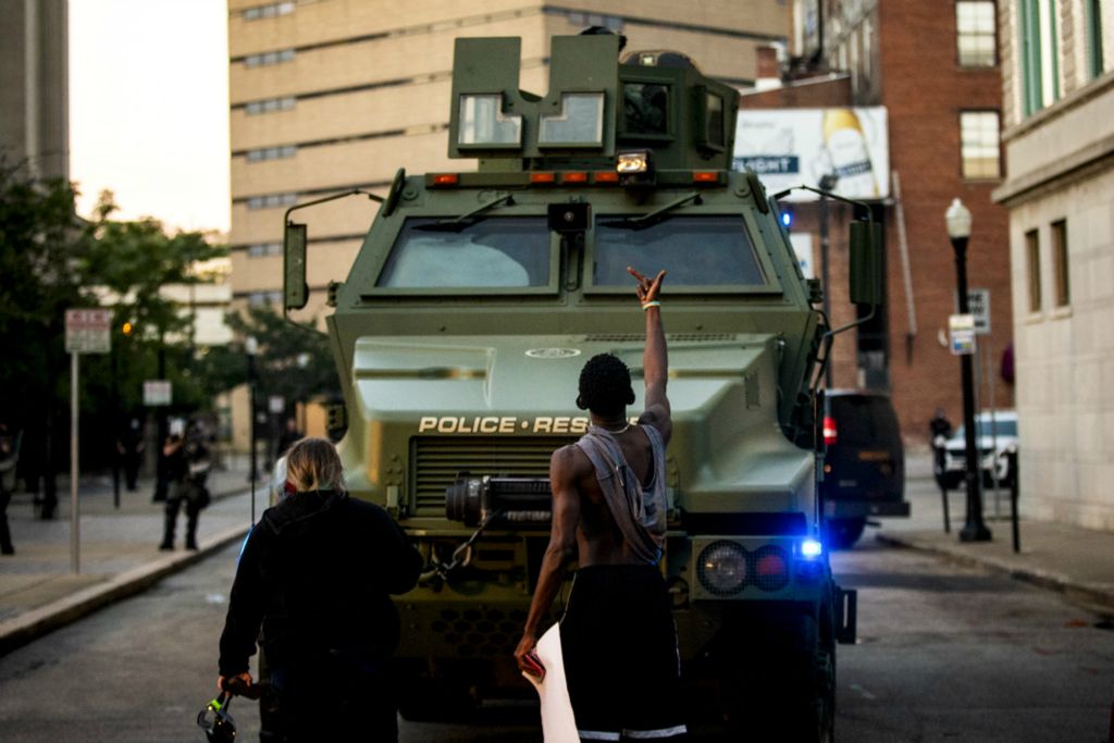 First Place, George S. Smallsreed Jr. Photographer of the Year - Large Market - Meg Vogel / The Cincinnati EnquirerA protester gestures to an armored police vehicle after Hamilton County Sheriff Deputies use tear gas on a large crowd of protesters outside the Hamilton County Courthouse in downtown Cincinnati on Sunday, May 31, 2020. This is the third night of protests in response to the death of George Floyd in Minneapolis.