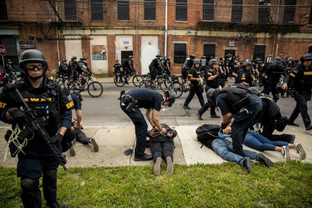 First Place, George S. Smallsreed Jr. Photographer of the Year - Large Market - Meg Vogel / The Cincinnati EnquirerCincinnati Police Officers arrest protesters on McMicken Street in Over-the-Rhine after the 8 p.m. curfew on Monday, June 1, 2020. This is the fourth night of protests in response to the death of George Floyd in Minneapolis.