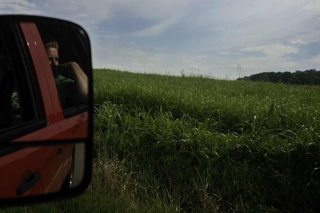 Second Place, George S. Smallsreed Jr. Photographer of the Year - Large Market - Joshua A. Bickel / The Columbus DispatchTeresa Cuckler looks out onto her family's cattle pasture on Friday, August 14, 2020 in Piketon, Ohio. Their small farm is near the south gate of the former Portsmouth Gaseous Diffusion Plant. They've had samples of their soil and crops taken for analysis by the U.S. Department of Energy, but have never seen results of the samples taken from their property. Cuckler's youngest son, Layton, 11, would've started at Zahn's Corner Middle School this year, but that school was closed in May 2019 after a U.S. Department of Energy air monitor detected traces of Americium near the school. The family is concerned they may have to sell their farm and move to stay safe and healthy.