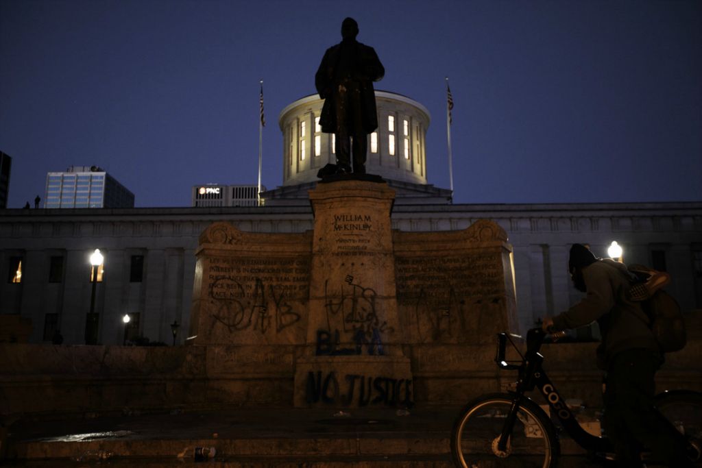 Second Place, George S. Smallsreed Jr. Photographer of the Year - Large Market - Joshua A. Bickel / The Columbus DispatchGraffiti is seen on a statue of President William McKinley outside the Ohio Statehouse as protests continue following the death of Minneapolis resident George Floyd on Saturday, May 30, 2020 in Columbus, Ohio.