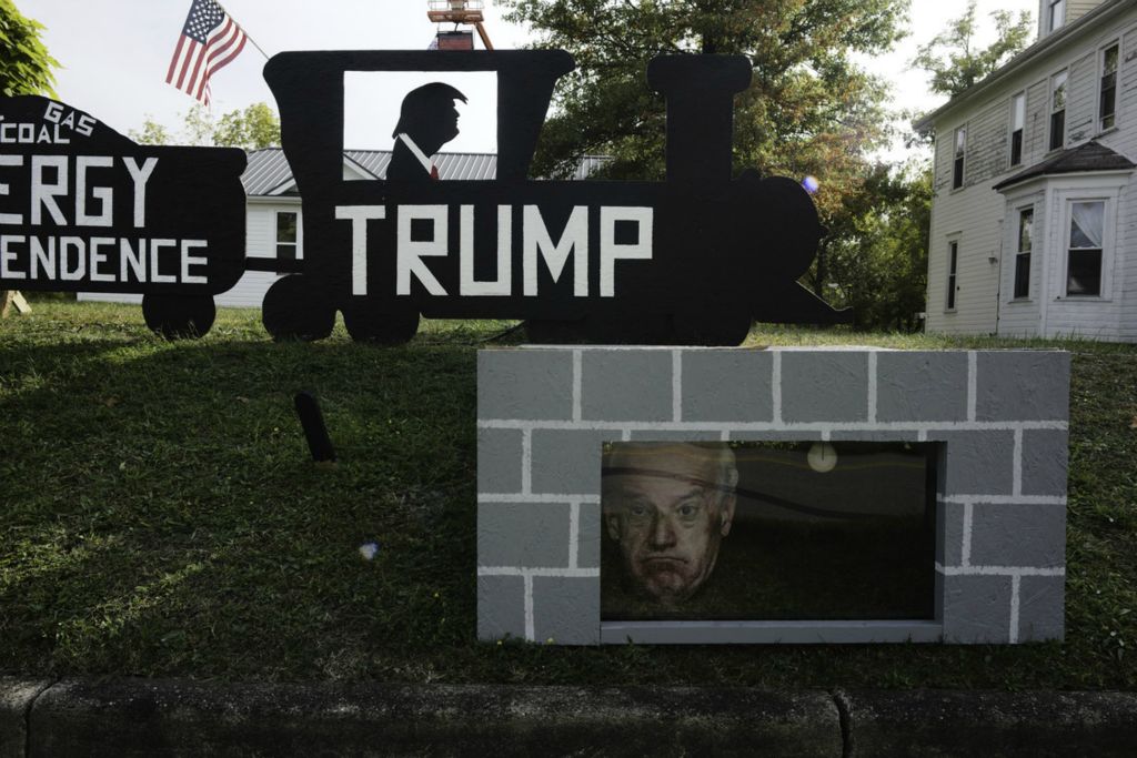Second Place, George S. Smallsreed Jr. Photographer of the Year - Large Market - Joshua A. Bickel / The Columbus DispatchA homemade "Trump Train" display, with “train cars” that show President Trump’s policy stances, including energy independence, sits outside Shaun Burnett's home on Friday, Oct. 9, 2020 in Woodsfield, Ohio. During the 2016 campaign, Trump made multiple remarks about bringing coal mining and production back to impoverished areas of Appalachia. Though mining and production are still below peak levels, Trump did succeed in rolling back at least a dozen environmental regulations related to coal.