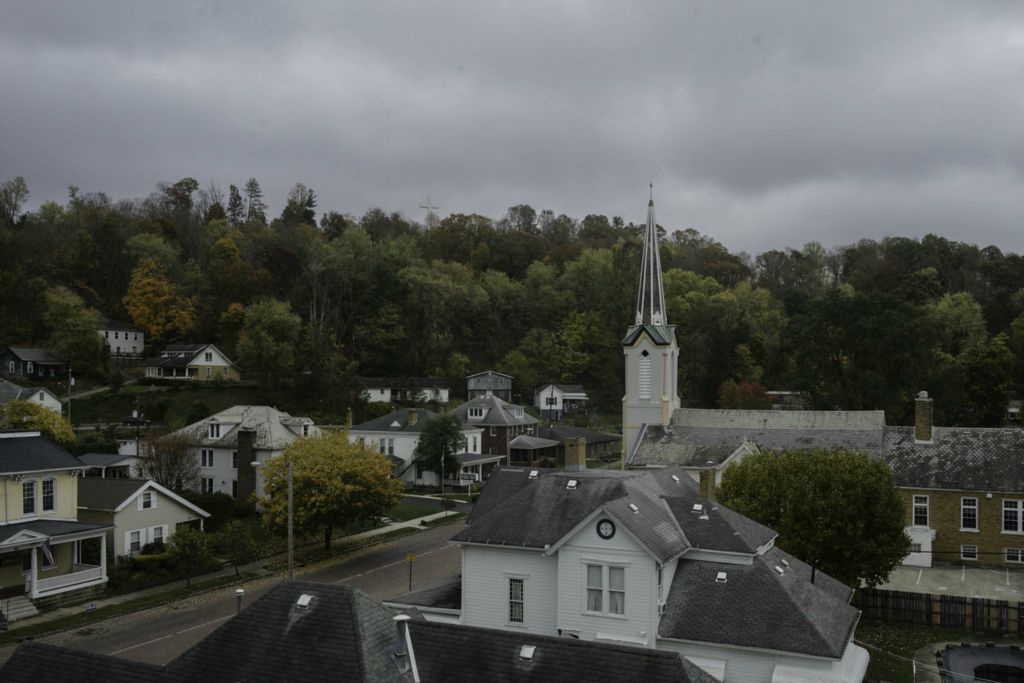 Second Place, George S. Smallsreed Jr. Photographer of the Year - Large Market - Joshua A. Bickel / The Columbus DispatchThe First Presbyterian Church and Nelsonville Cross seen on Wednesday, Oct. 28, 2020 in Nelsonville, Ohio. After the collapse of the local coal industry, the town of 5,000 relied on manufacturing to anchor its economic base. As manufacturing slowed and was outsourced, the town, like many others in the Hocking Valley, are pivoting to tourism to revitalize the area.