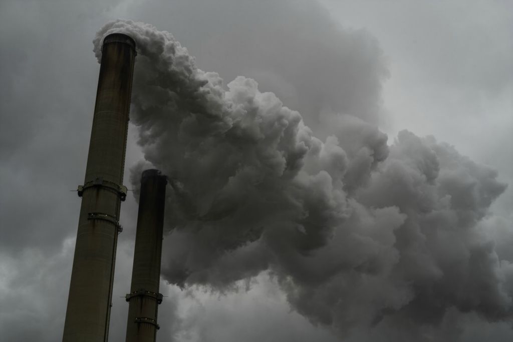 Second Place, George S. Smallsreed Jr. Photographer of the Year - Large Market - Joshua A. Bickel / The Columbus DispatchSmoke billows out of the stacks of the Gavin Power Plant on Monday, Dec. 21, 2020 in Cheshire, Ohio. The plant’s units will reach their lifespan in the mid-2020s and the incoming Biden administration campaigned on a promise to transition all electricity to zero-emissions by 2035, so it’s likely the plant will shut down in the next few years. Though it’s one of the United States' largest polluters, emitting 13 million tons of carbon dioxide every year, it is also Gallia County’s largest taxpayer, paying about $5 million in taxes in 2019, with 70 cents of every tax dollar going to the school district, according to the county auditor.