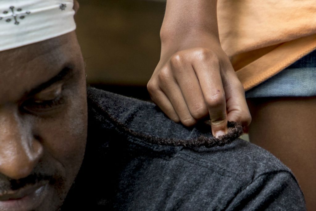 First Place, George S. Smallsreed Jr. Photographer of the Year - Small Market - Jessica Phelps / Newark AdvocateMarley Jhordan, 10, plays with her dad, Rese Jhordan's hair as they sit on their front porch June 17, 2020 in Newark, Ohio. Asked her favorite thing about her dad, Marley quietly said “He’s a really great dad. I love him a lot.”