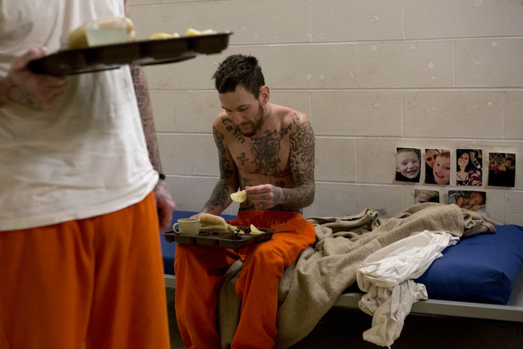 First Place, George S. Smallsreed Jr. Photographer of the Year - Small Market - Jessica Phelps / Newark AdvocateJosh Bechtol eats lunch on his cot located in the jails recreation room due to overcrowding in January, 2020. Bechtol is serving a sentence for failure to pay child support. Many of the inmates at the Coshocton County Justice Center are in for the same reason. This adds to overcrowding in the jail as well as makes it harder for the men to get a job and keep up with child support when they are released. It's a catch 22 the jail administrator, Chip Uschides, wishes he could change. 