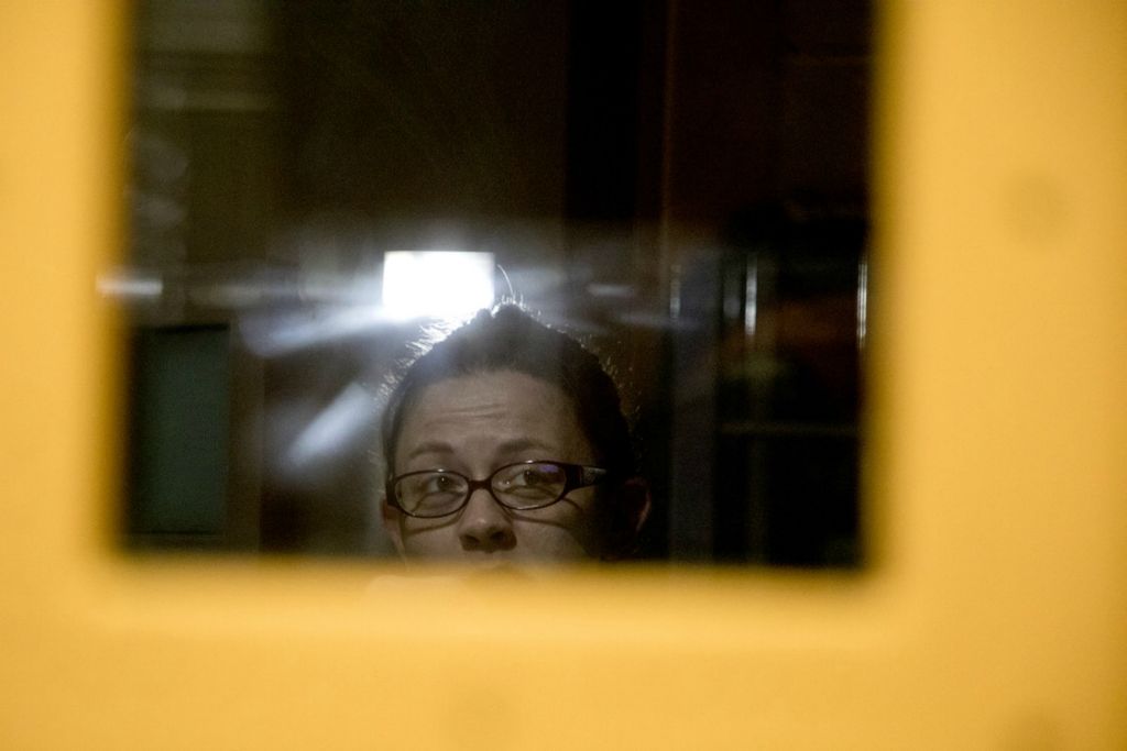 First Place, George S. Smallsreed Jr. Photographer of the Year - Small Market - Jessica Phelps / Newark AdvocateA female inmate looks out from her cell block while brushing her teeth on the morning of May 29, 2020. 