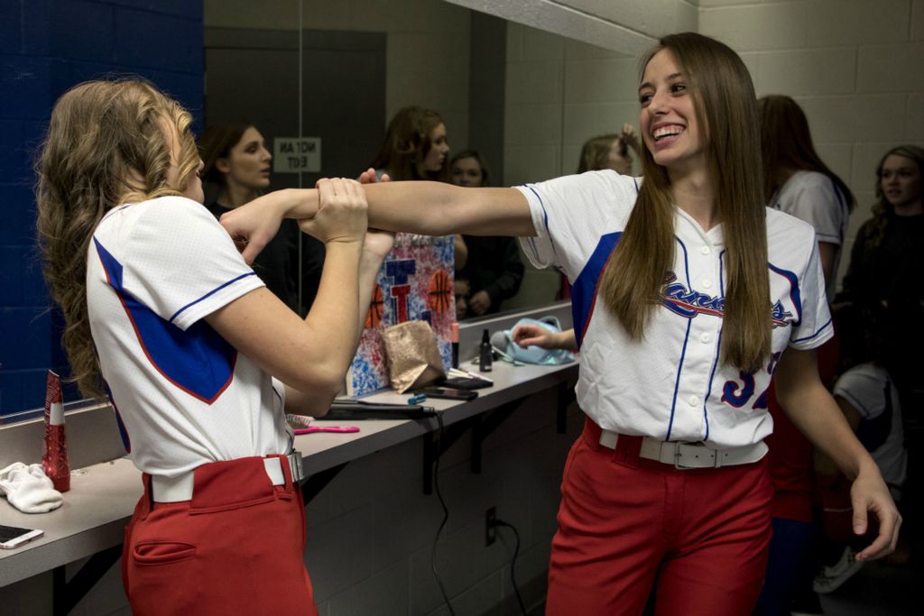 First Place, George S. Smallsreed Jr. Photographer of the Year - Small Market - Jessica Phelps / Newark AdvocateLaila Schmitt and Heather Young get ready in the Lakewood locker rooms before having their team pictures taken March 13, 2020. Their Coach Jon Griffith wanted to make sure the team got their pictures taken before the shut down in case their season was canceled. At the time there were so many uncertainties and the girls were all holding out hope they would only be out three weeks of their season.