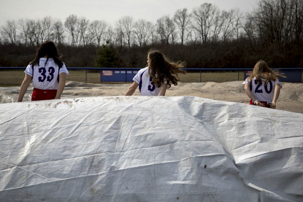 First Place, George S. Smallsreed Jr. Photographer of the Year - Small Market - Jessica Phelps / Newark AdvocateLakewood players uncover the field for the last time before the shutdown began March 13 2020. At the time there were so many uncertainties and the girls were all holding out hope they would only be out three weeks of their season.