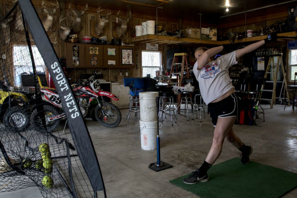 First Place, George S. Smallsreed Jr. Photographer of the Year - Small Market - Jessica Phelps / Newark AdvocateKeelie Davis practices her hitting skills in her garage in April during the shut down. Davis, like her teammates, remained hopeful their season would not be completely canceled and wanted to keep her skills sharp.