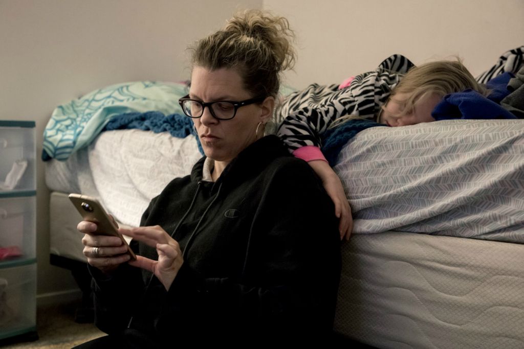 First Place, George S. Smallsreed Jr. Photographer of the Year - Small Market - Jessica Phelps / Newark AdvocateKyndall Hrebluk gently rests her hand on her mom, Leah's shoulder as she dozes on her bed, October 24, 2019.