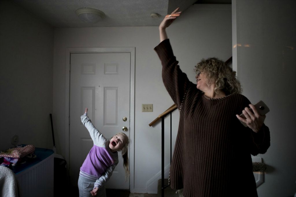 First Place, George S. Smallsreed Jr. Photographer of the Year - Small Market - Jessica Phelps / Newark AdvocateDancing in the kitchen with her daughters is just one of the many ways Leah Hrebluk shows her love and sense of adventure by trying to make every moment count. November 14, 2020. 