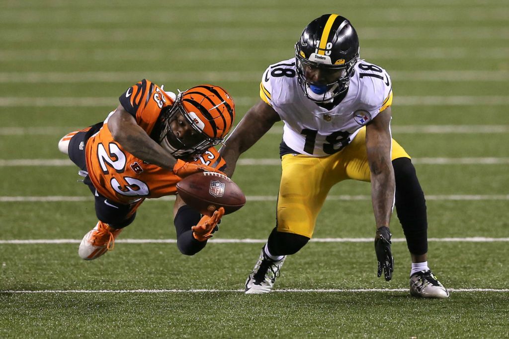 Second Place, Sports Action - Kareem Elgazzar / The Cincinnati Enquirer, “Near Interception”Cincinnati Bengals cornerback Darius Phillips (23) nearly intercepts a pass intended for Pittsburgh Steelers wide receiver Diontae Johnson (18) in the first quarter during an game, Dec. 21, 2020, at Paul Brown Stadium in Cincinnati. 