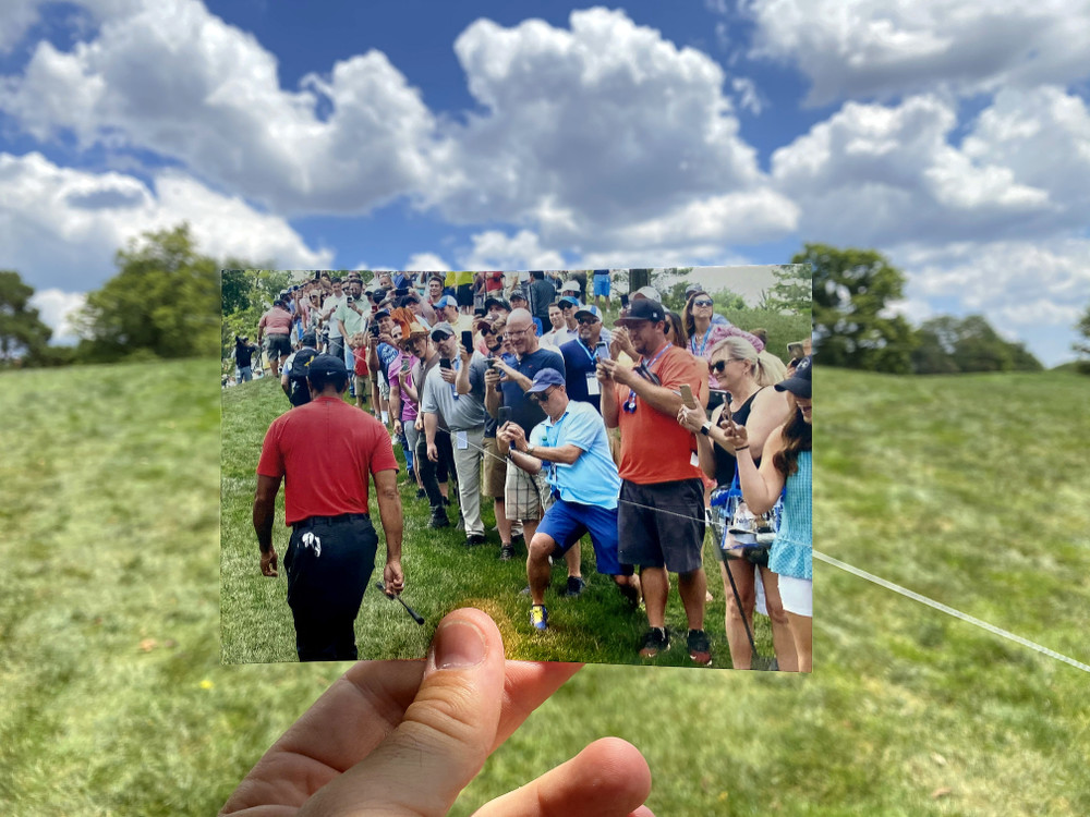 Award of Excellence, Sports Feature - Adam Cairns / The Columbus Dispatch, “Memorial Without Fans”A photo of spectators watching Tiger Woods on the way up the hill to the 3rd green from the 2019 Memorial Tournament is held in the same spot it was taken one year later at the 2020 tournament being played without spectators due to COVID-19 at Muirfield Village Golf Club in Dublin.   