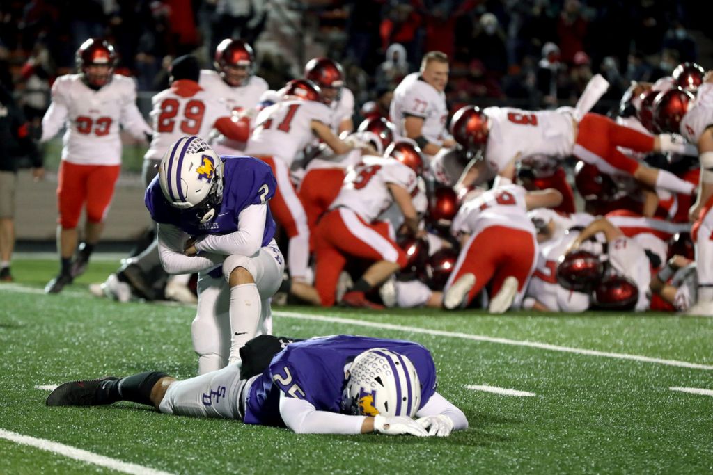 Award of Excellence, Sports Feature - Shane Flanigan / ThisWeek Community News, “Double OT Championship Loss”DeSales' JJ Baughman (25) and Nicky Pentello (2) drop to the turf after Baughman's missed field goal in double overtime secures a 31-28 victory for Chardon in the Division III OHSAA state championship game on Nov. 21, 2020, at Paul Brown Tiger Stadium in Massillon.