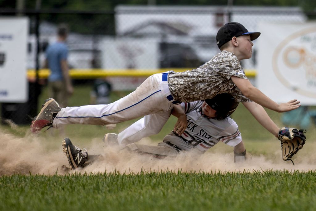 First Place, Ron Kuntz Sports Photographer of the Year - Jessica Phelps / Newark AdvocateCorbin Smaley of the Jackson County Black Sox slides into Jacoby Arcuri at second base. The Licking Valley Dirtbags 9U beat the Jackson County Black Sox 5-4 in their first game of the Nations Ohio State Championship at Mound City in Newark June 17, 2020.