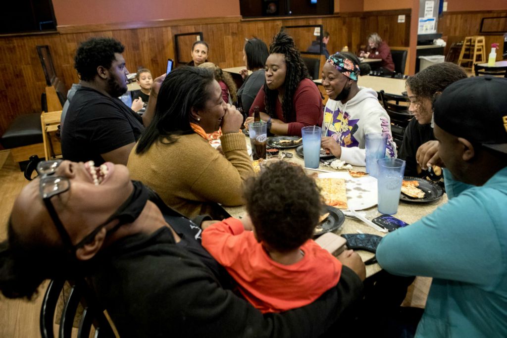 First Place, Ron Kuntz Sports Photographer of the Year - Jessica Phelps / Newark AdvocateThe Croom family celebrate Taya Croom's birthday at the Pizza Cottage on November 3, 2020. The family has set down deep roots in a town where many Black families decide to leave, feeling isolated in a mostly white community. The family has actively gotten involved and coach different sports at the Pee Wee, middle school and high school level.