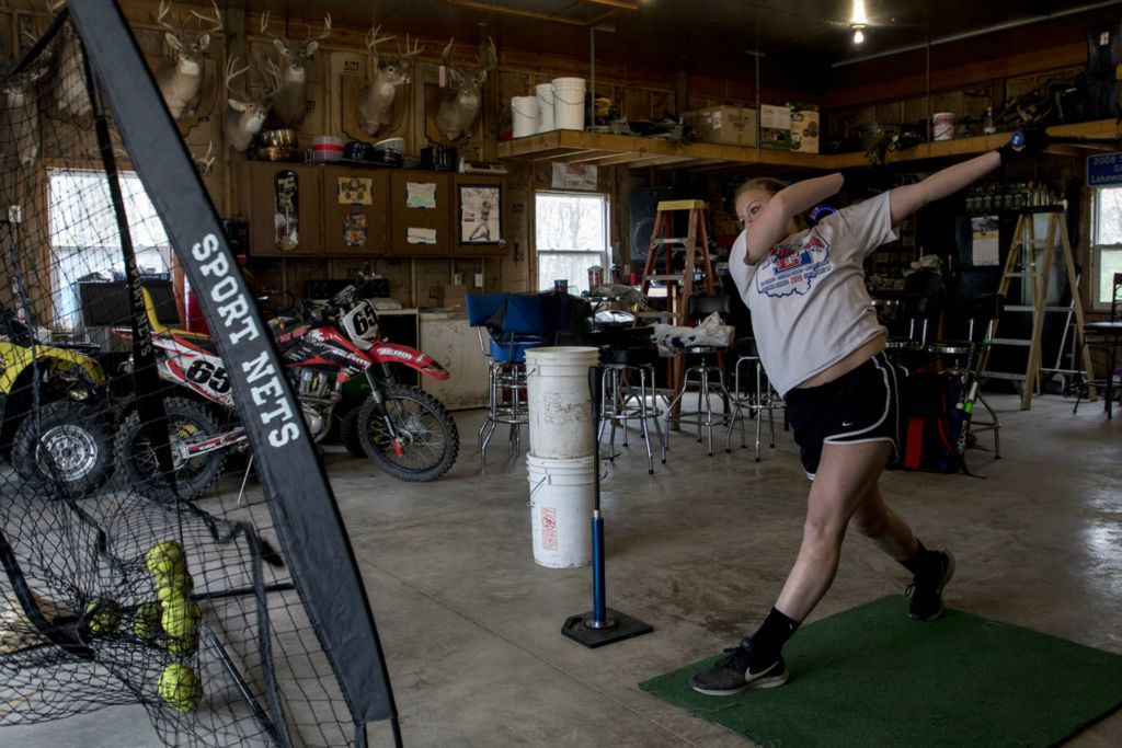 First Place, Ron Kuntz Sports Photographer of the Year - Jessica Phelps / Newark AdvocateKeelie Davis practices her hitting skills in her garage in April during the shut down. Davis, like her teammates, remained hopeful their season would not be completely canceled and wanted to keep her skills sharp.