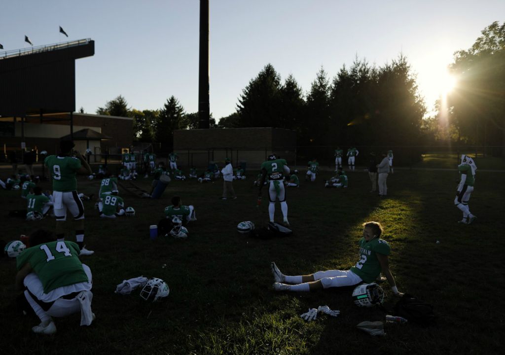 Second Place, Ron Kuntz Sports Photographer of the Year - Kyle Robertson / The Columbus DispatchDublin Coffman Trey Hedderly (12) listens to music in their outdoor locker room before their game against Hilliard Davidson at Dublin Coffman High School in Dublin, Ohio on September 18, 2020. 