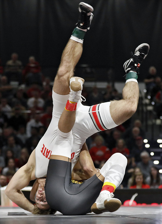 Second Place, Ron Kuntz Sports Photographer of the Year - Kyle Robertson / The Columbus DispatchOhio State's Luke Pletcher flips over Arizona State's Navonte Demison during a 141lb match at the Covelli Center at Ohio State University on January 6, 2019. Pletcher who is ranked 1st beat Demison TF, 19-4.