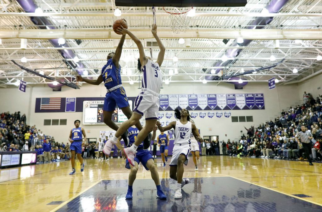 Second Place, Ron Kuntz Sports Photographer of the Year - Kyle Robertson / The Columbus DispatchGahanna Lincoln's Sean Jones (5) blocks the shot of Pickerington Central's Josh Harlan (3) in the final minute during the 4th quarter of their game at Pickerington Central High School on January 10, 2020. 