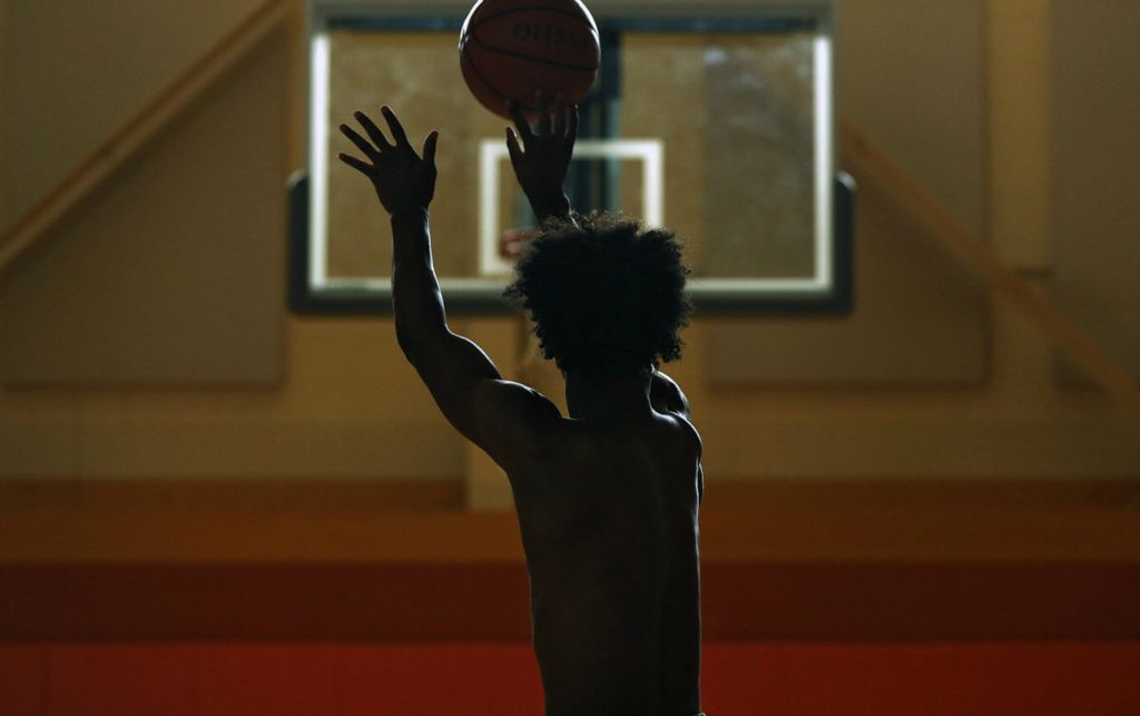 Second Place, Ron Kuntz Sports Photographer of the Year - Kyle Robertson / The Columbus DispatchColumbus South's Trevell Adams practices his three point shot at Driving Park Community Center Center during the the summer on August 20, 2019. 