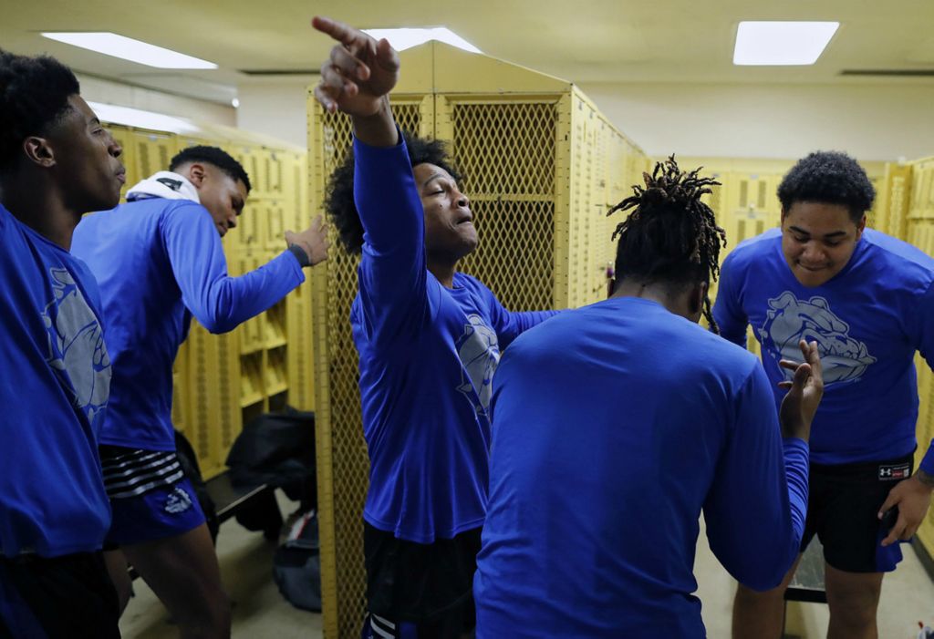 Second Place, Ron Kuntz Sports Photographer of the Year - Kyle Robertson / The Columbus DispatchTrevell Adams, left, dances with teammates Taquan Simington, front, and Sam Barton, back right, before the team takes on Briggs High School in a key Columbus City league matchup at Briggs High School in Columbus, Ohio on January 28, 2020. 