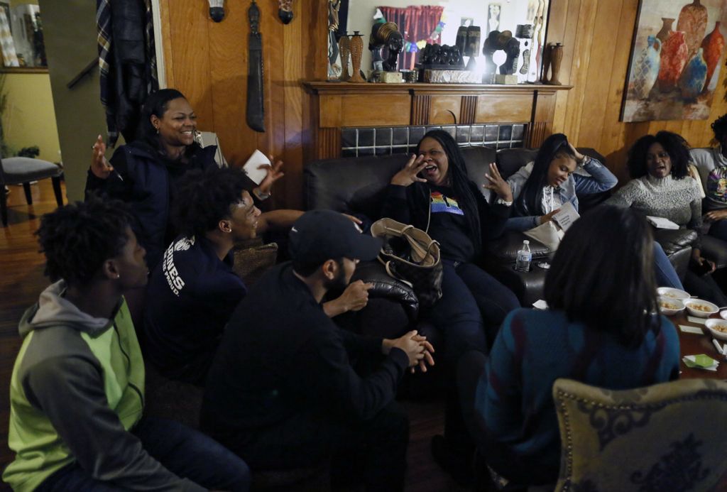 Second Place, Ron Kuntz Sports Photographer of the Year - Kyle Robertson / The Columbus DispatchColumbus South Trevell Adams and his mother, Staci Rouse, play the game ak-rô-nym during his brother, Michael’s, 22nd birthday, with family and friends on November 9, 2019.  