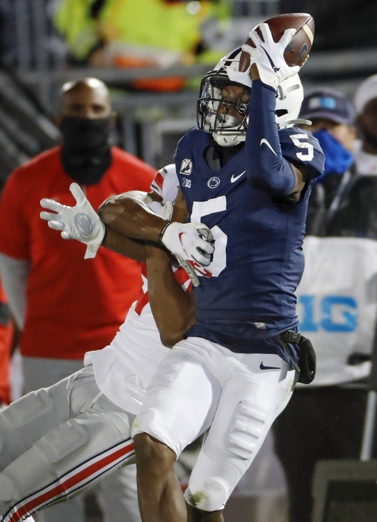 Third Place, Ron Kuntz Sports Photographer of the Year - Adam Cairns / The Columbus DispatchPenn State Nittany Lions wide receiver Jahan Dotson (5) makes a catch against his helmet while being defended by Ohio State Buckeyes cornerback Shaun Wade (24) during the fourth quarter of the NCAA football game at Beaver Stadium in University Park, Pa. on Sunday, Nov. 1, 2020.