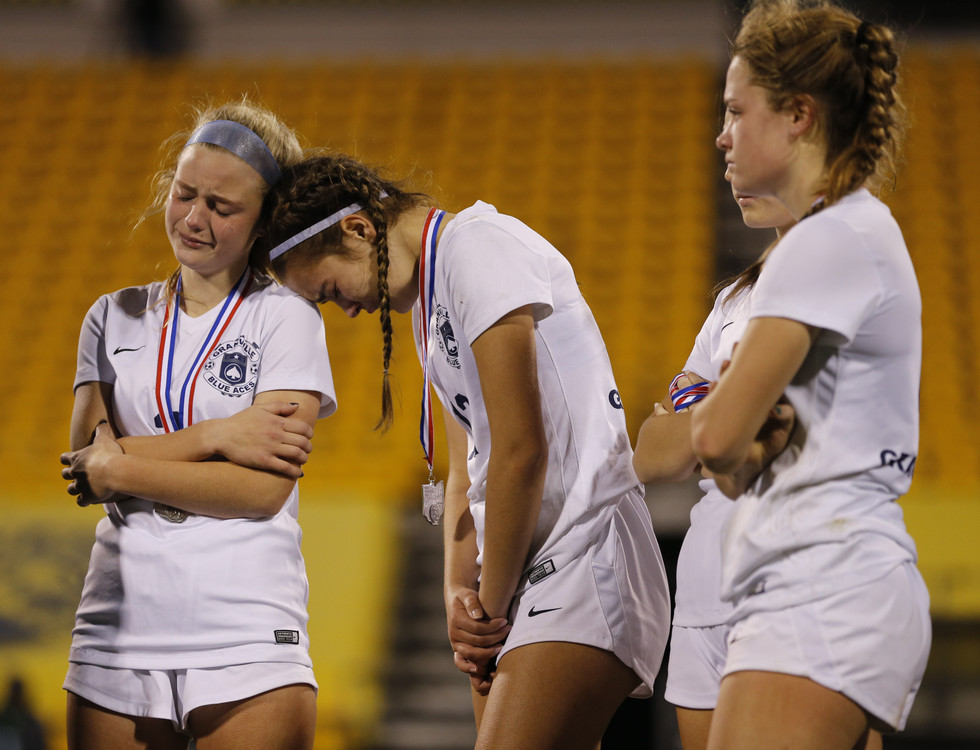 Third Place, Ron Kuntz Sports Photographer of the Year - Adam Cairns / The Columbus DispatchGranville players, from left, Audrey Nolan, Izzy Lauffer and Ella Schneider show their disappointment following their 2-1 loss to Madison in the OHSAA girls soccer Div. II state championship at Mapfre Stadium in Columbus on Friday, Nov. 13, 2020. 