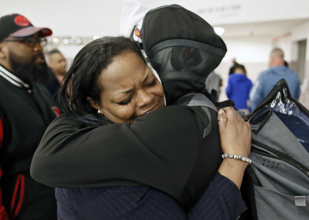 Second Place, Sports Picture Story - Kyle Robertson / The Columbus Dispatch, “Trevell Adams”Columbus South's Trevell Adams hugs his mother, Staci Rouse, after losing a OHSAA playoff game against Westerville Central High School at Pickerington Central High School on March 4, 2020.  The 3rd seed South lost to the 13th seed Westerville Central 65-62 in the district semifinals. 