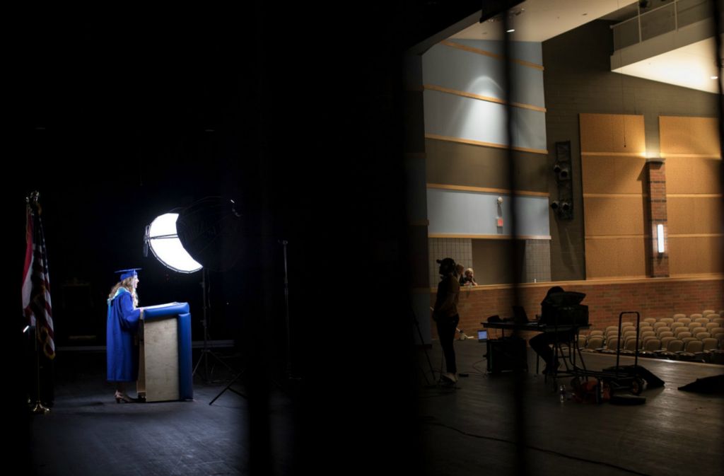 First Place, Team Picture Story - Courtney Hergesheimer / The Columbus Dispatch, “Social Distancing”Madison Voinovich, the first valedictorian of the new Olentangy Berlin High School, should have addressed her class center stage from the Schottenstein Center on Ohio State's campus, but instead, she records her valedictorian speech for a film crew in an empty school auditorium, Tuesday, June 2, 2020. 