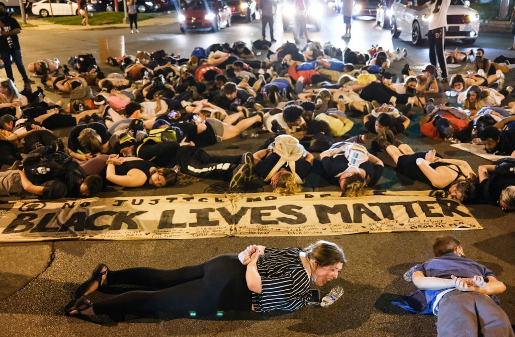 Second Place, Team Picture Story - Jeremy Wadsworth / The Blade, “Protests Erupt”Black Lives Matters protestors lie in the middle of the street at Sylvania Avenue and Jackman Road on Wednesday, June 3, 2020,  in Toledo.