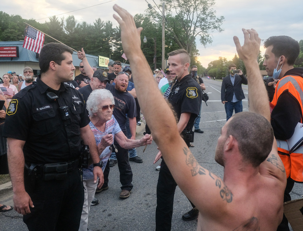 Second Place, Team Picture Story - Jeremy Wadsworth / The Blade, “Protests Erupt”Monroe County Sheriff’s deputies separates Black Lives Matter protesters, right, from counter protesters during a Hi-Frequency protest  Friday, June 12, 2020, in Lambertville, Michigan. 