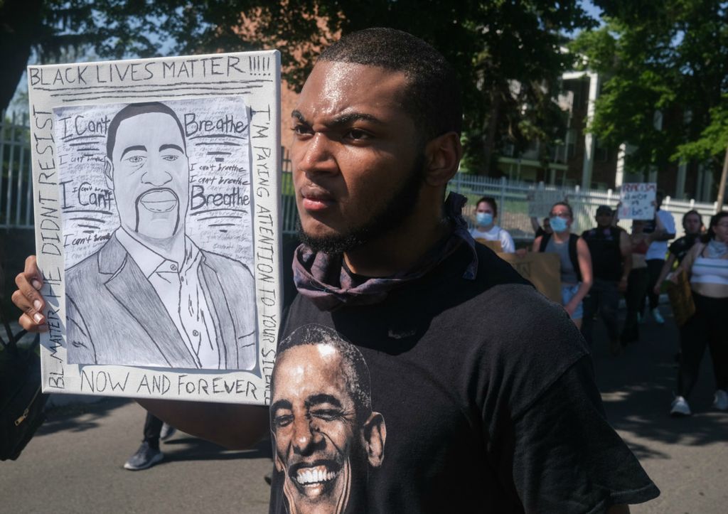 Second Place, Team Picture Story - Jeremy Wadsworth / The Blade, “Protests Erupt”Nick Stewart, University of Toledo freshman, marches in protest of the death of George Floyd Tuesday, June 2, 2020, on Bancroft Street in Toledo.