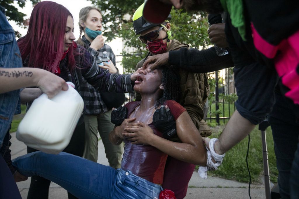 Second Place, Team Picture Story - Rebecca Benson / The Blade, “Protests Erupt”A protester gets milk poured onto her face after getting tear gassed during the 5th day of protests in Minneapolis, Minn., on Saturday May 30, 2020. Protests erupted in Minneapolis on May 26 over the death of George Floyd who was killed by a Minneapolis Police officer. 