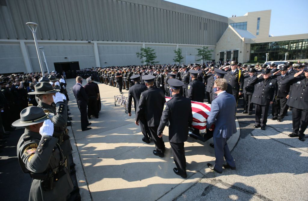 First Place, Team Picture Story - Dave Zapotosky / The Blade, “Officer Killed”The casket of slain Toledo police Officer Anthony Dia,is carried into Savage Arena for a memorial service Tuesday, July 7, 2020 on the University of Toledo campus. 